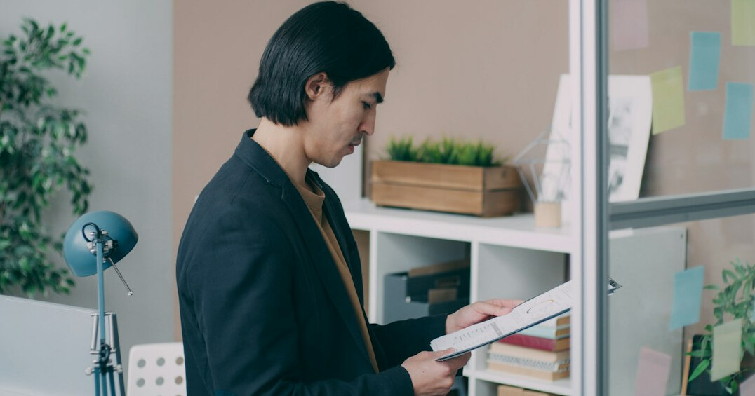 researcher examining documents